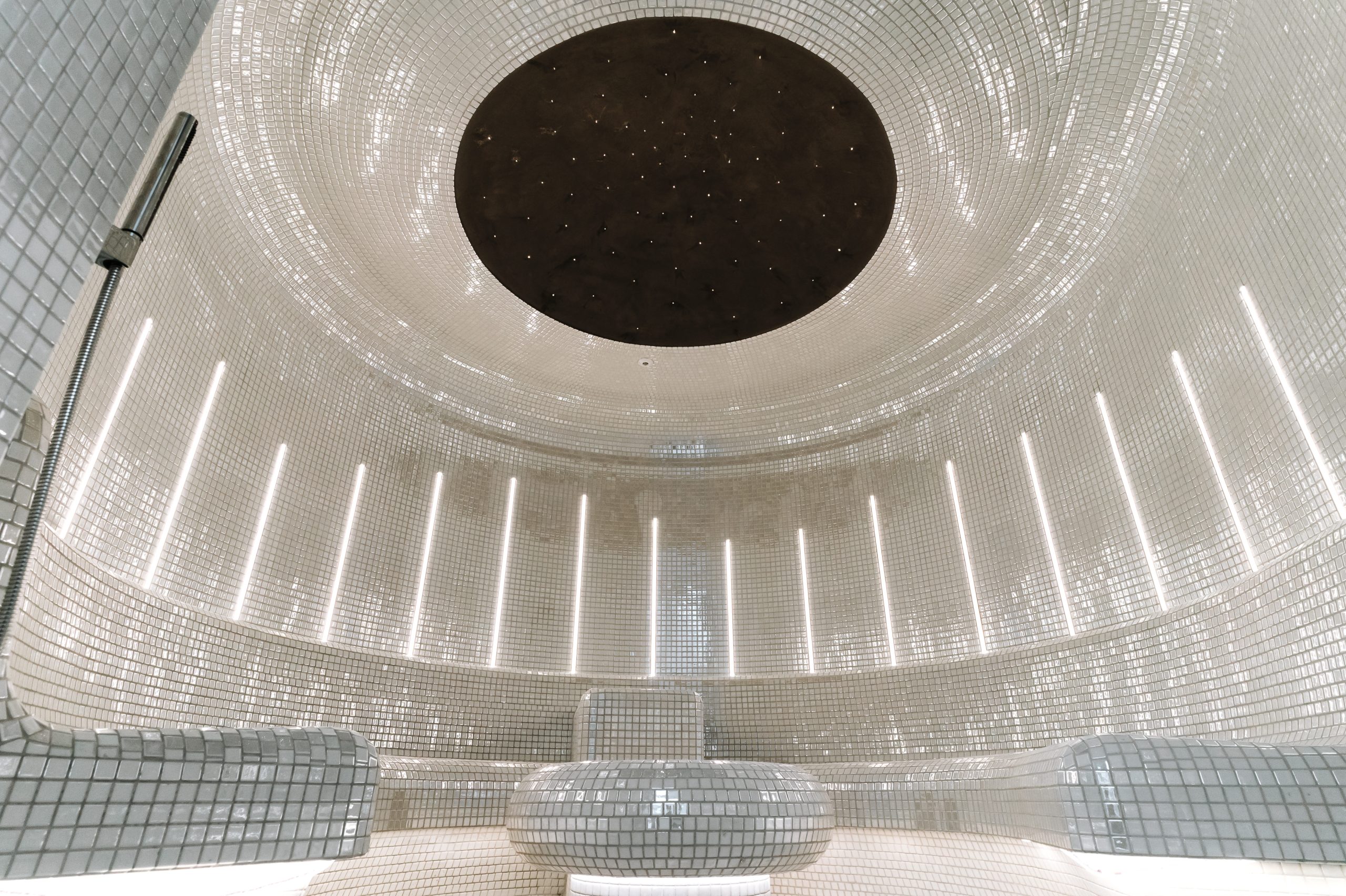 Salt inhalation steam room at Mottram Hall featuring contemporary design, ambient lighting, and integrated salt therapy elements.